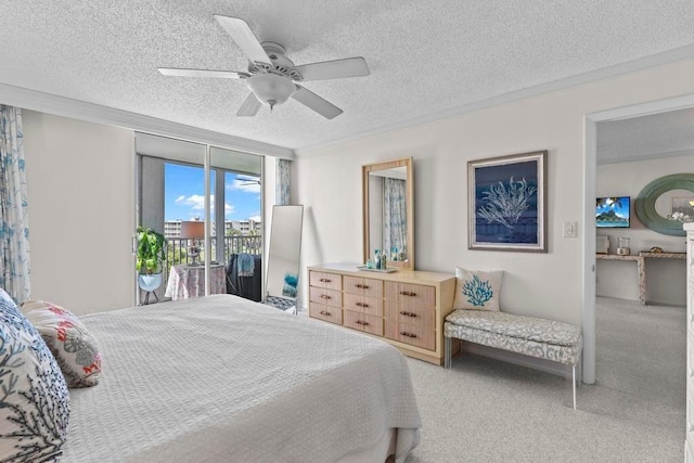 bedroom with ceiling fan, access to exterior, a textured ceiling, and floor to ceiling windows