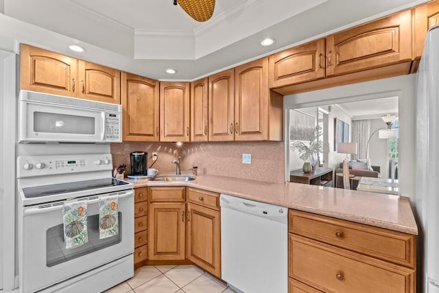 kitchen with backsplash, white appliances, light tile patterned flooring, ornamental molding, and sink