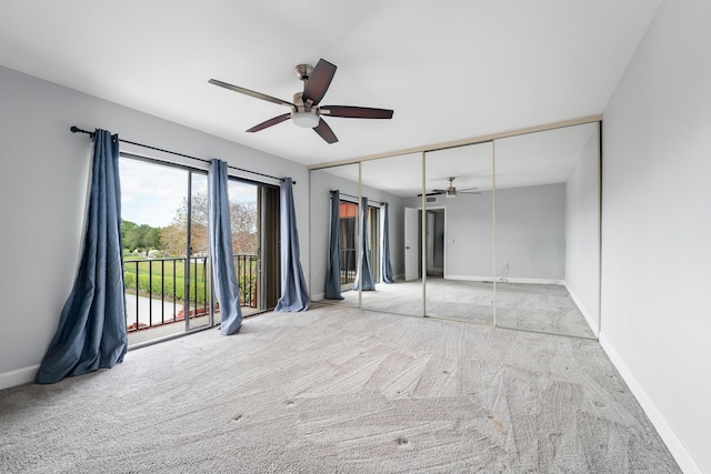 carpeted empty room with ceiling fan