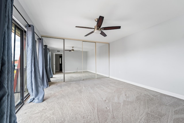 unfurnished bedroom with carpet floors, ceiling fan, and a closet