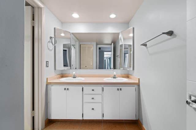 bathroom with vanity and tile patterned floors