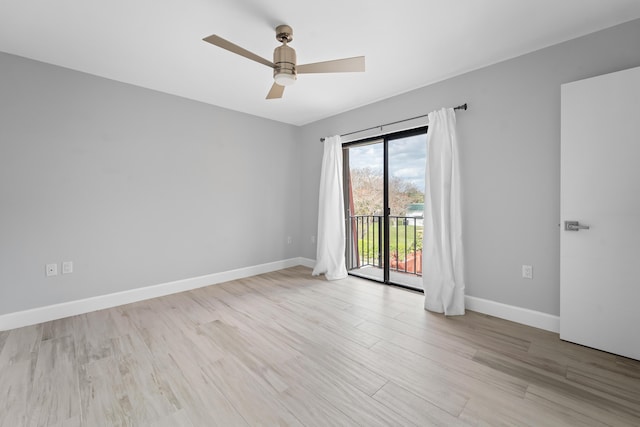 unfurnished room featuring ceiling fan and light wood-type flooring