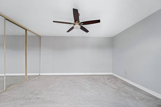 unfurnished room featuring carpet flooring and ceiling fan