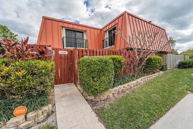 view of property exterior featuring a lawn