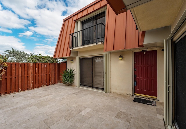 entrance to property with a patio area