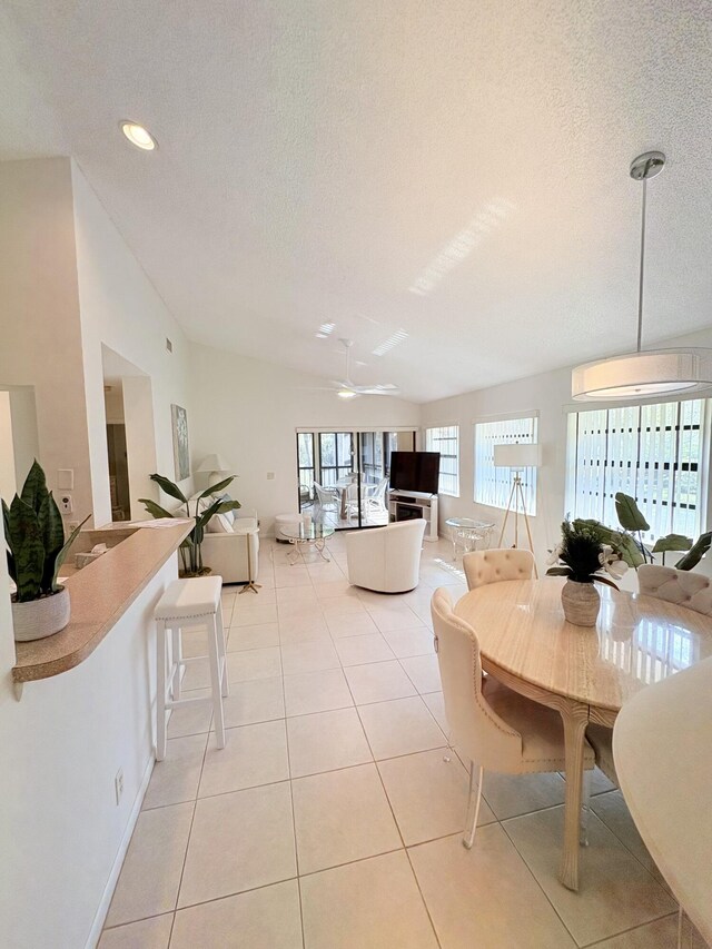 kitchen featuring ceiling fan, light tile patterned flooring, sink, and white appliances