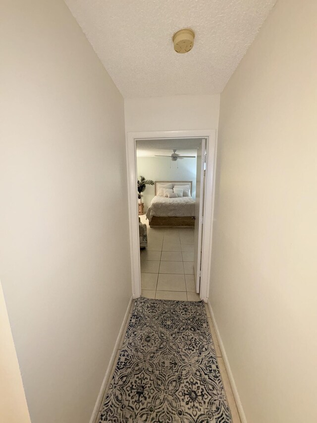 bathroom featuring toilet, vanity, and tile patterned floors