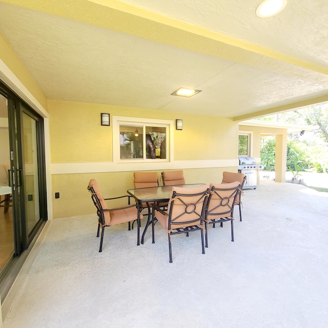 view of patio with a grill