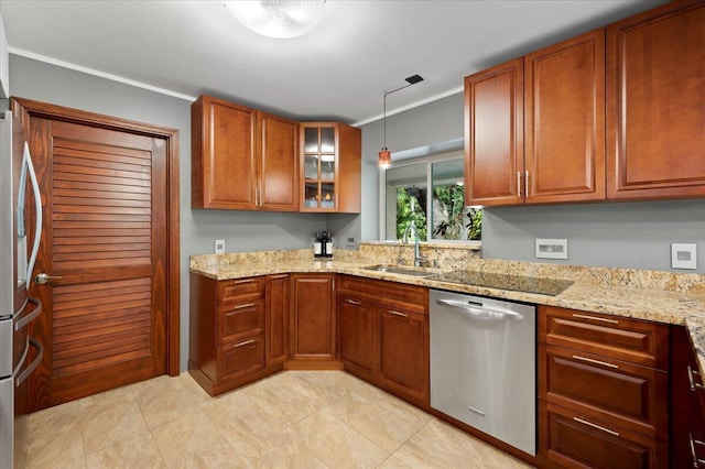 kitchen featuring stainless steel appliances, light stone countertops, sink, and hanging light fixtures