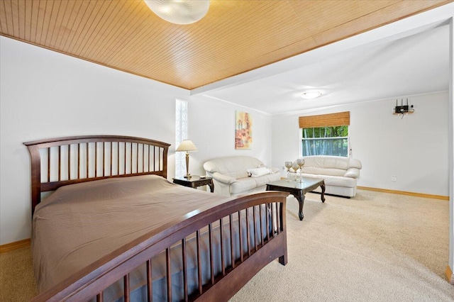 carpeted bedroom with wooden ceiling