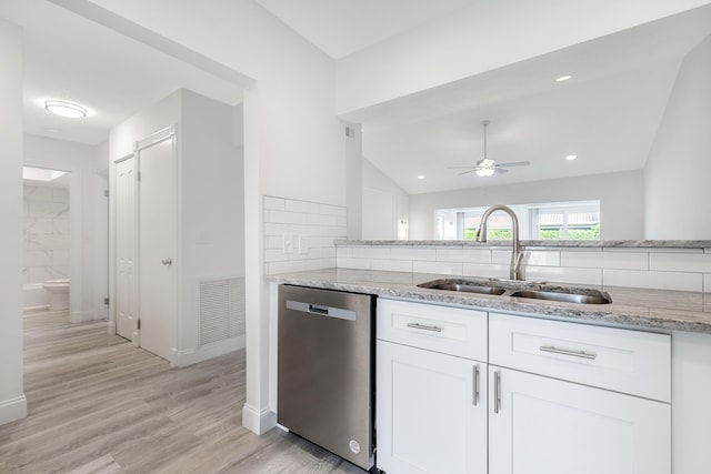 kitchen featuring dishwasher, white cabinetry, tasteful backsplash, sink, and ceiling fan