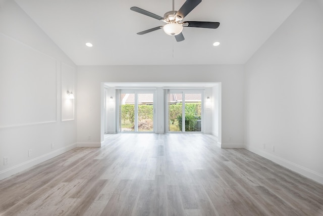 unfurnished living room with lofted ceiling, ceiling fan, and light hardwood / wood-style flooring