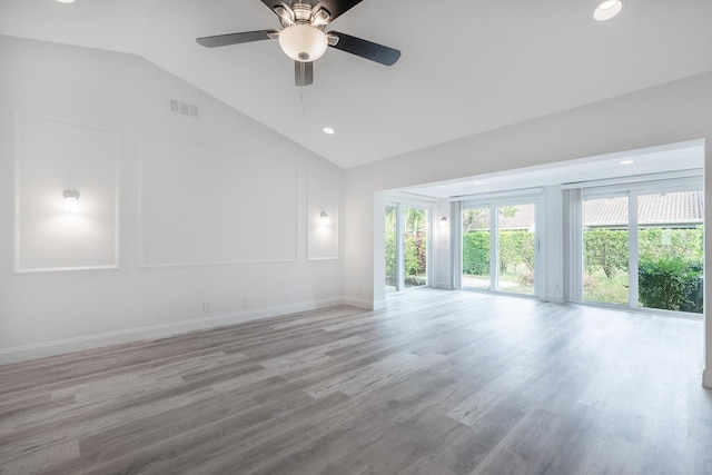 unfurnished room featuring ceiling fan, vaulted ceiling, and light hardwood / wood-style floors