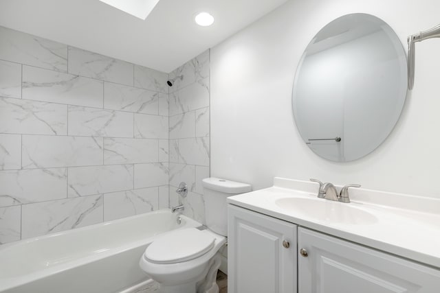 full bathroom with toilet, tiled shower / bath, and vanity