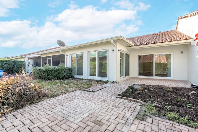 back of property with a patio area