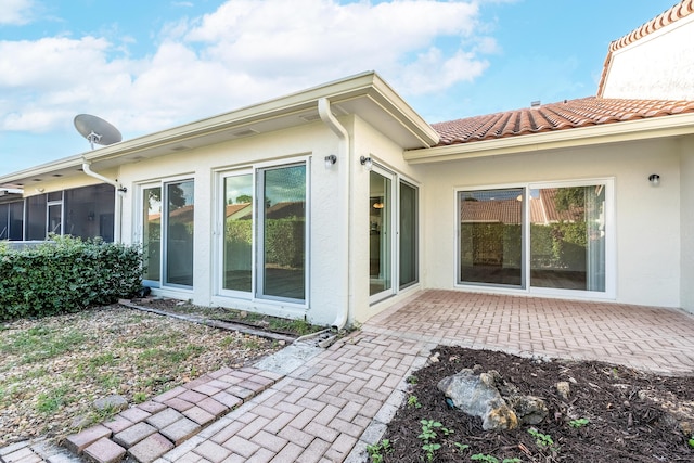 rear view of house with a patio