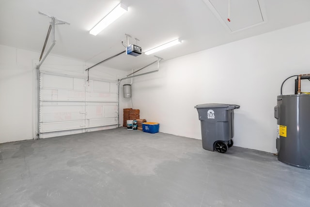 garage with electric water heater and a garage door opener