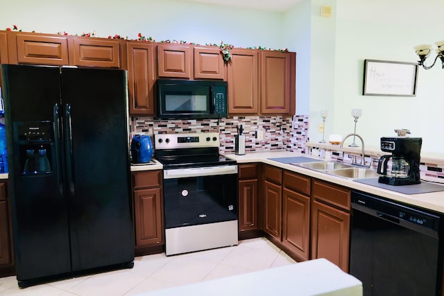 kitchen with tasteful backsplash, sink, black appliances, and light tile patterned flooring