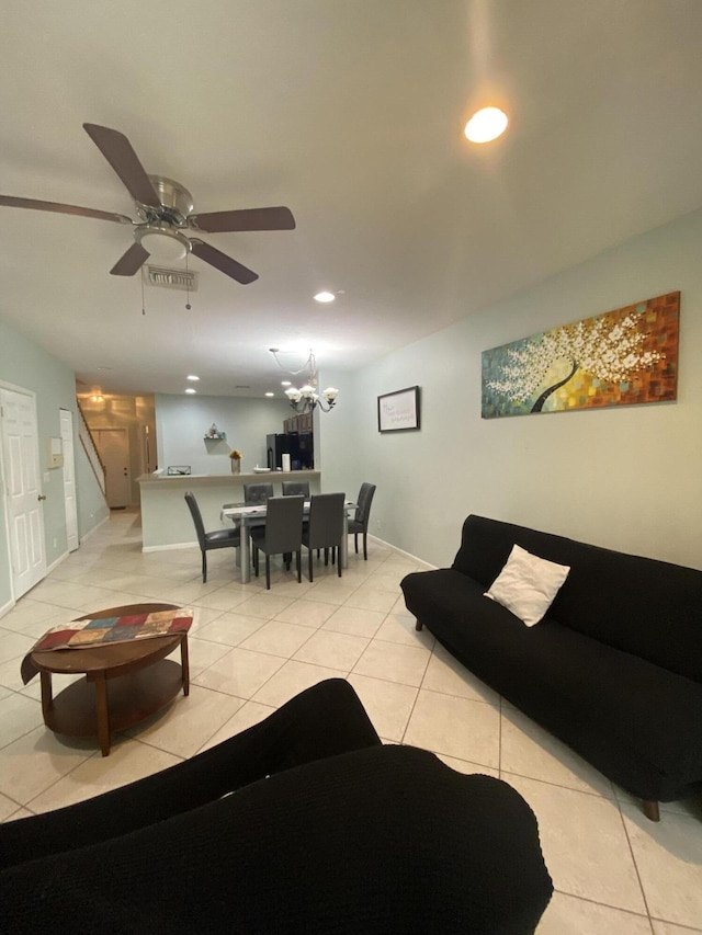 living area with light tile patterned floors, visible vents, and recessed lighting