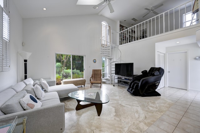 living room with high vaulted ceiling, light tile patterned floors, and ceiling fan