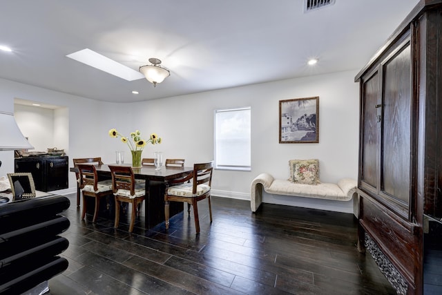 dining space with a skylight