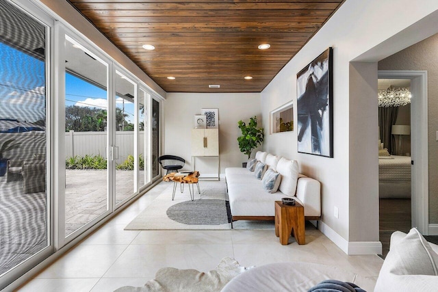 sunroom featuring wood ceiling