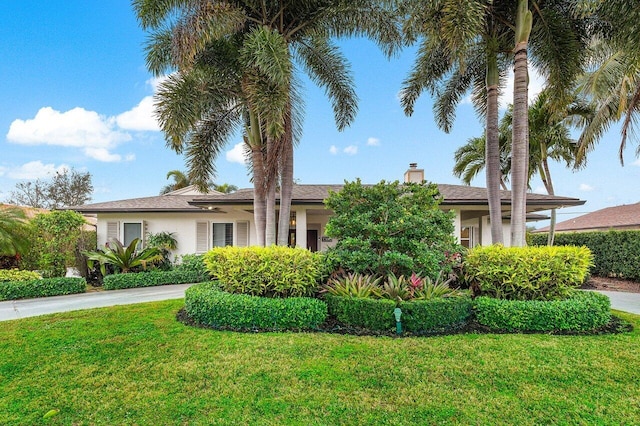 view of front of property with a front lawn