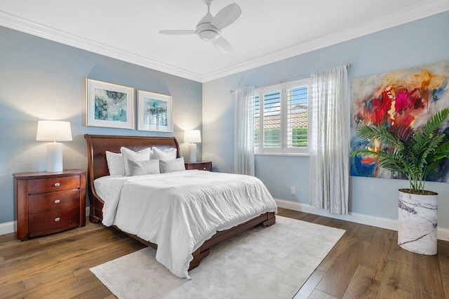 bedroom featuring crown molding, dark hardwood / wood-style floors, and ceiling fan