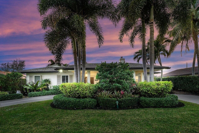 view of front of property with a yard