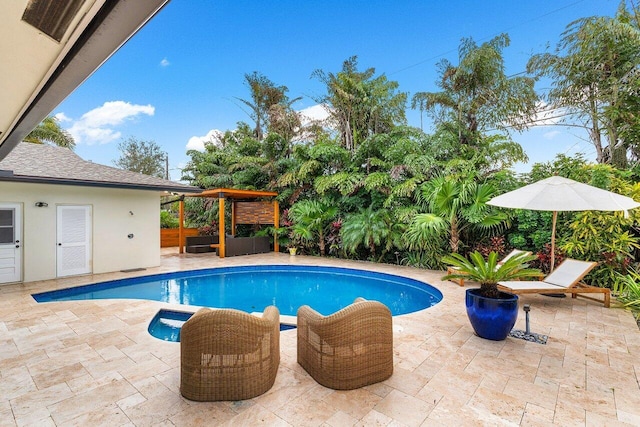 view of swimming pool featuring a gazebo and a patio