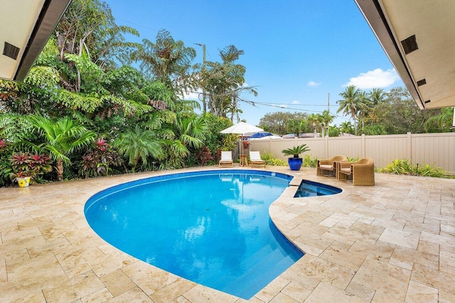 view of swimming pool featuring outdoor lounge area and a patio area