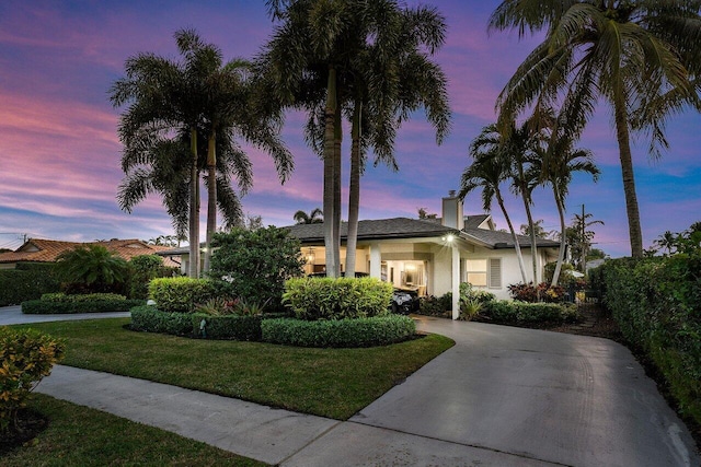 view of front of home with a lawn