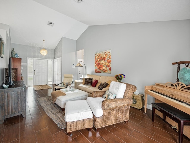 living room featuring vaulted ceiling