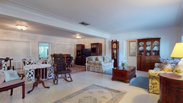 living room featuring visible vents and crown molding