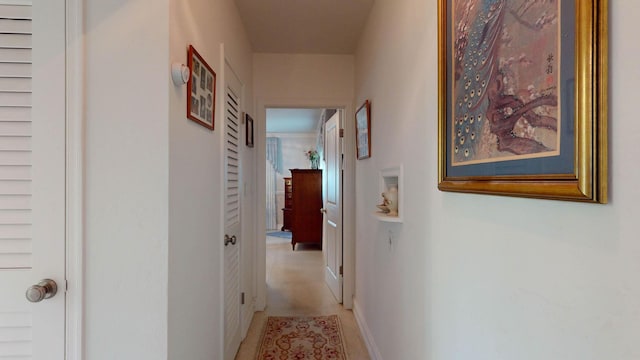 corridor featuring baseboards