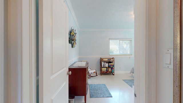 bathroom featuring ornamental molding and baseboards