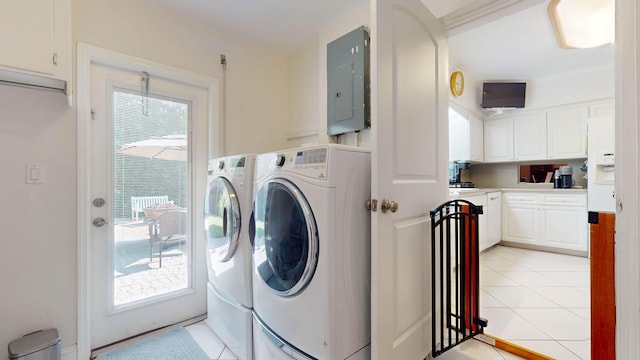 washroom with laundry area, electric panel, a wealth of natural light, and washing machine and clothes dryer