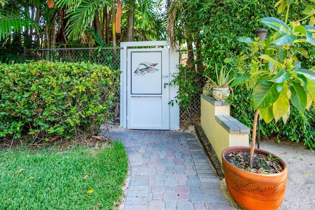 doorway to property with a gate and fence