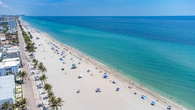 aerial view with a view of the beach and a water view