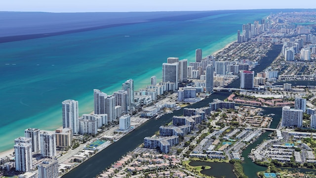 drone / aerial view featuring a view of city and a water view