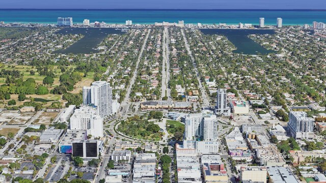 drone / aerial view with a view of city and a water view