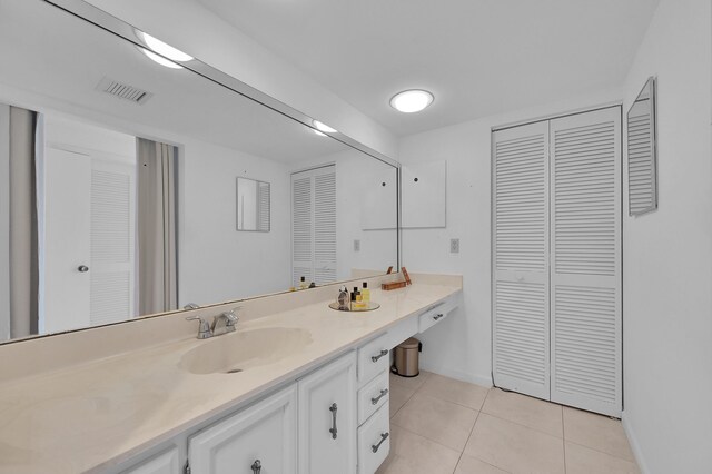 bathroom featuring tile patterned floors and vanity