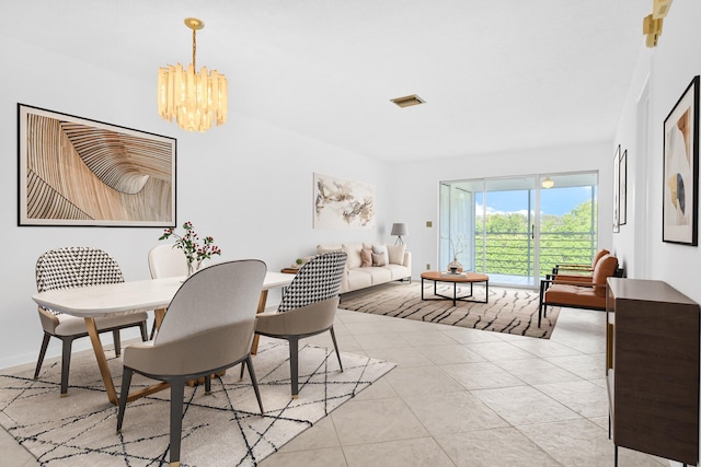 dining room with an inviting chandelier and light tile patterned floors