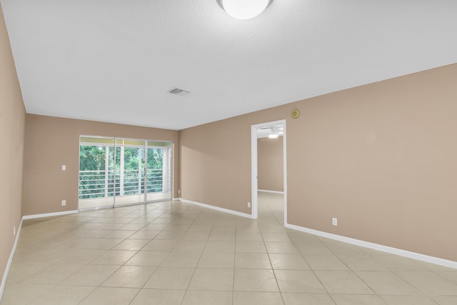 view of tiled spare room