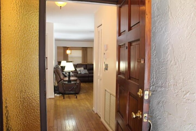 hallway featuring wood-type flooring