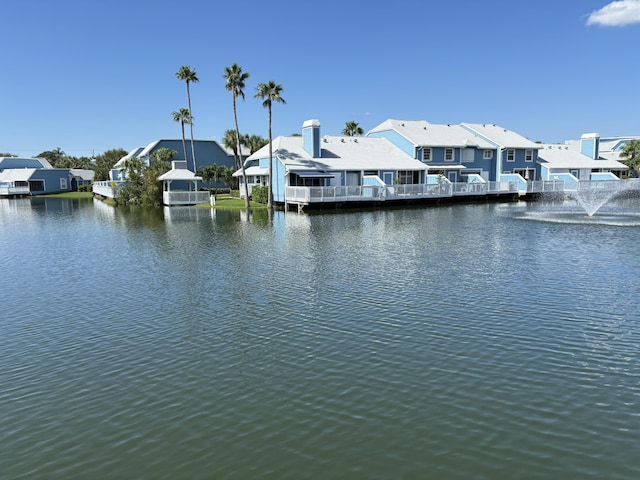 dock area featuring a residential view and a water view