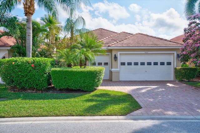 view of front of property with a garage