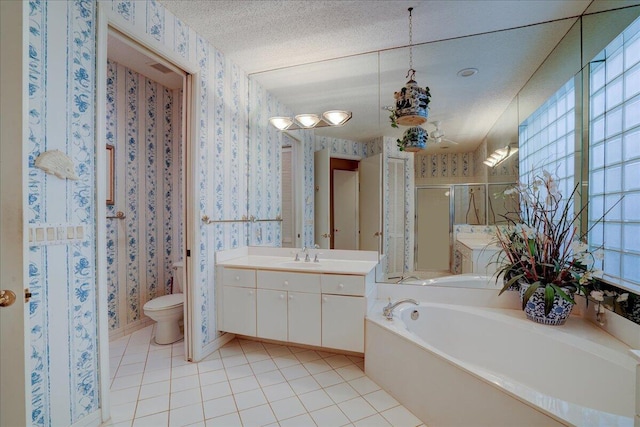 full bathroom featuring toilet, separate shower and tub, a textured ceiling, vanity, and tile patterned flooring