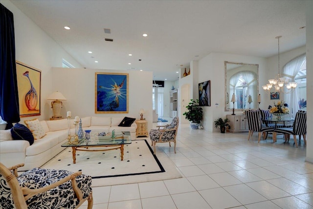 tiled living room featuring a notable chandelier