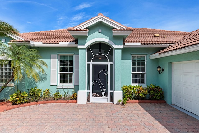 entrance to property featuring a garage